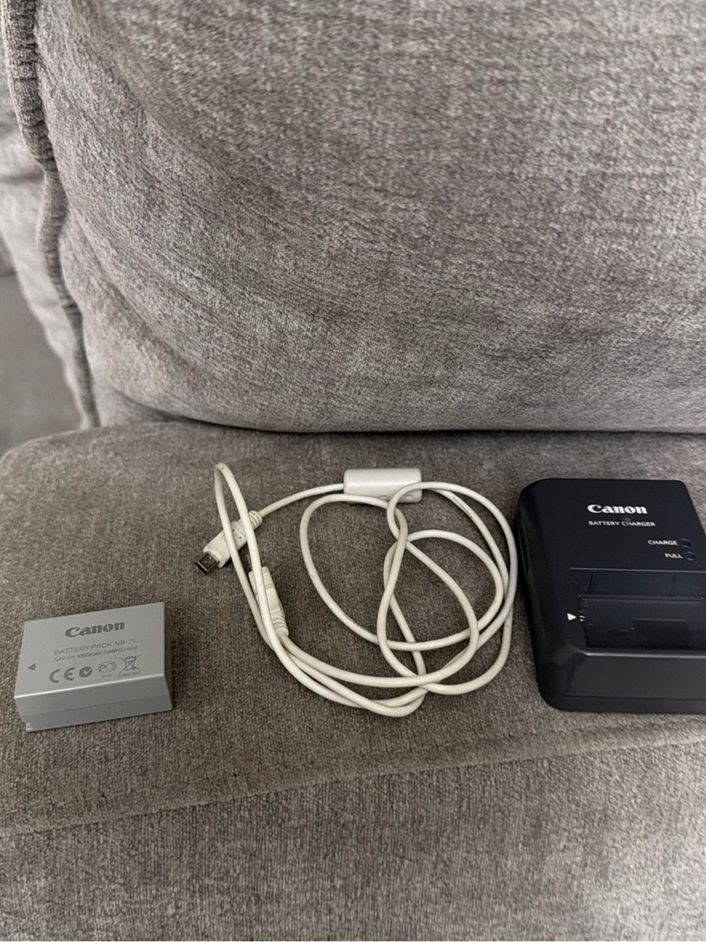 Canon Black Battery Charger with Silver LP-E12 Battery and White USB Cable